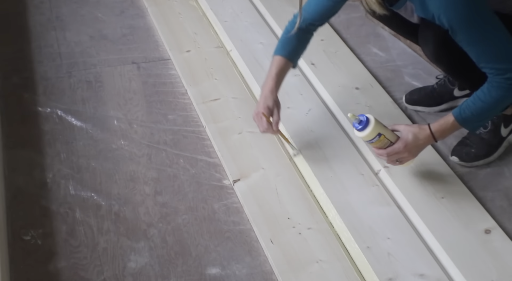 painting the glue on the boards 